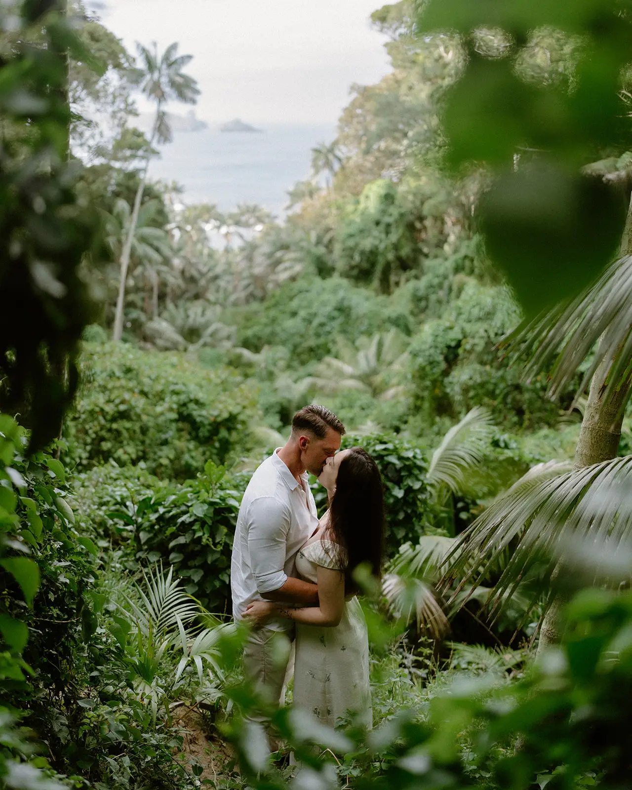 The couple surrounded by ferns and kentia palms, Lord Howe Island