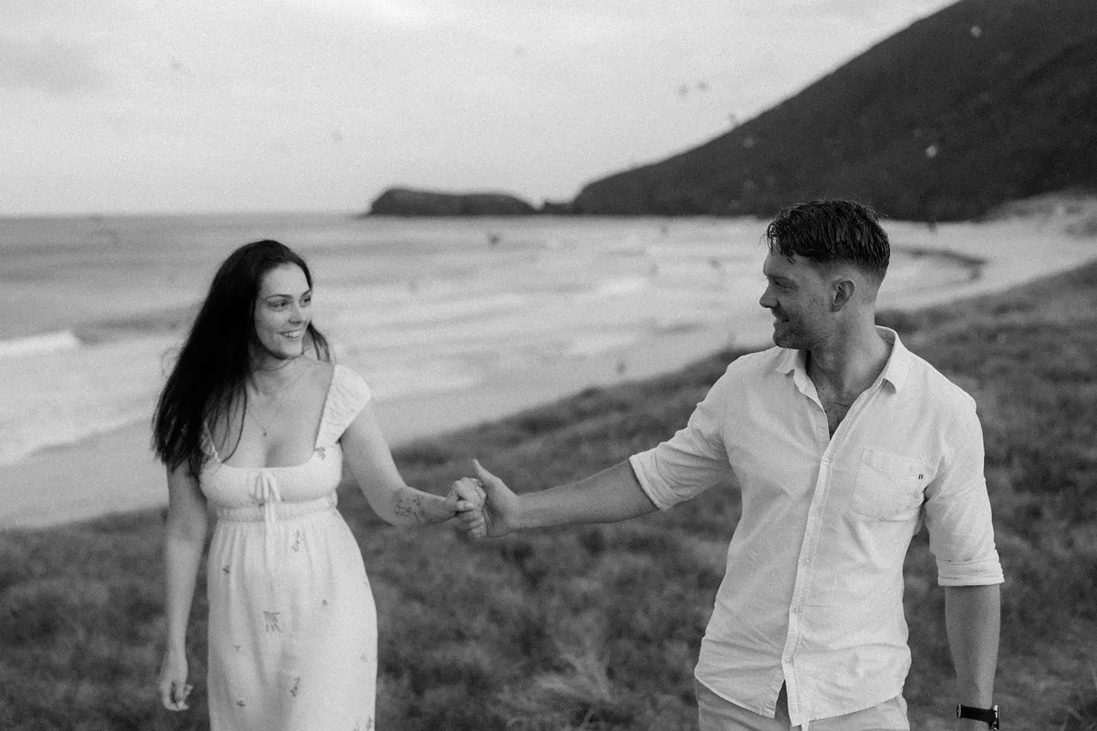 Brent leading Mel by the hand along the shore, Lord Howe Island
