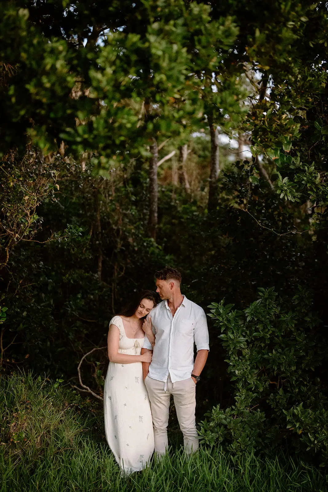 Mel and Brent standing in a forest clearing, Lord Howe Island