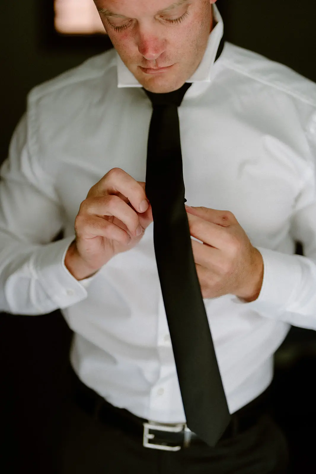 Brent doing up his tie on the morning of the wedding, Lord Howe Island