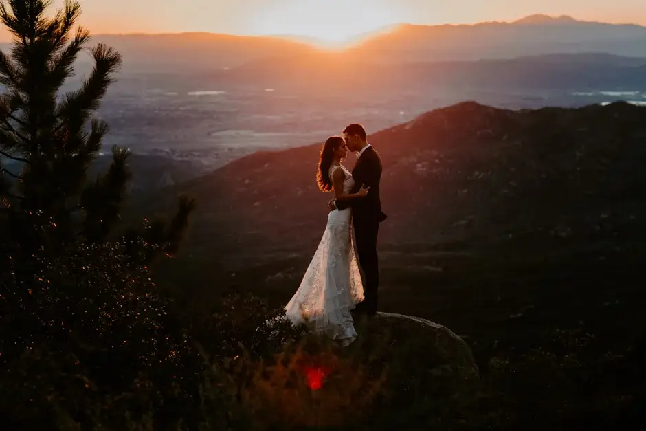 Aaron and Amanda on a rock above the valley at sunset, California