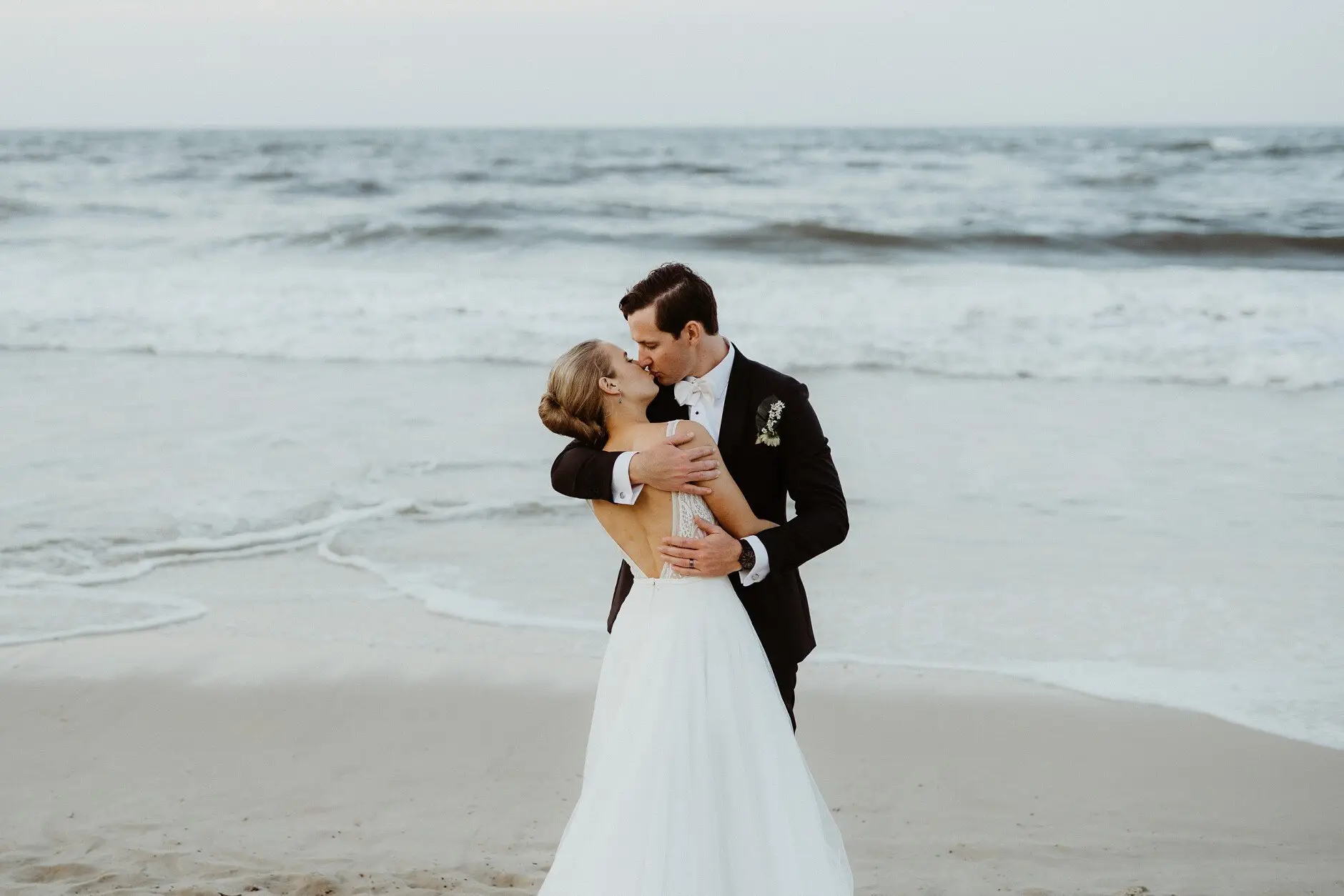Clair and James kissing on the beach at sunset, Burleigh Heads
